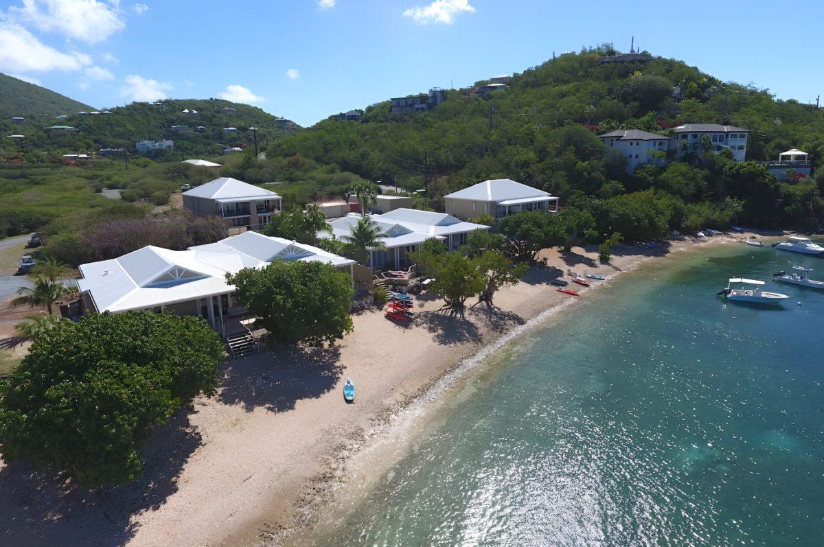 Beach Oasis villa with chaise lounges on the white sand beach at Chocolate Hole, St. John