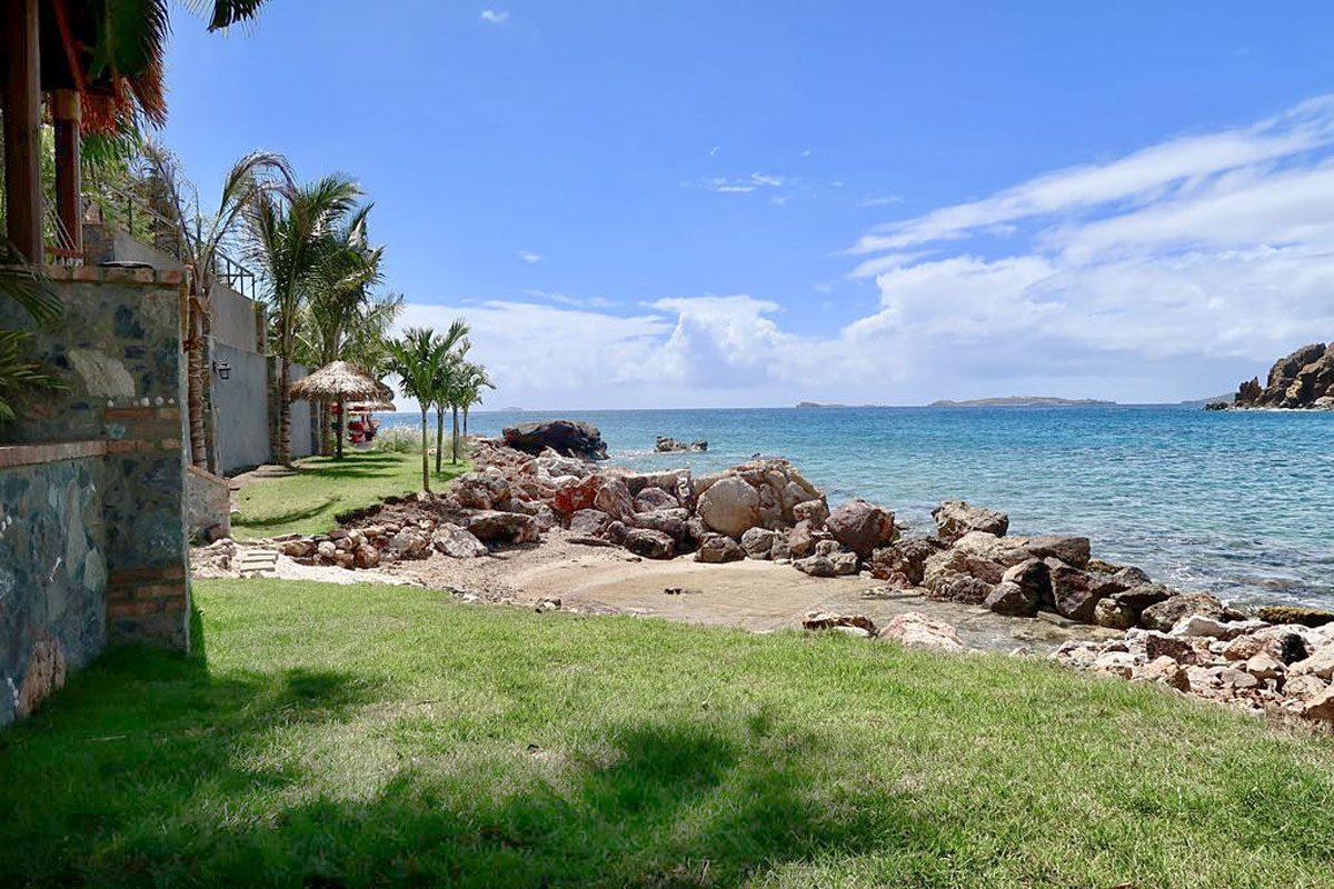 Lime in de Coconut villa on its private beach at Chocolate Hole, St. John, with the ocean steps away