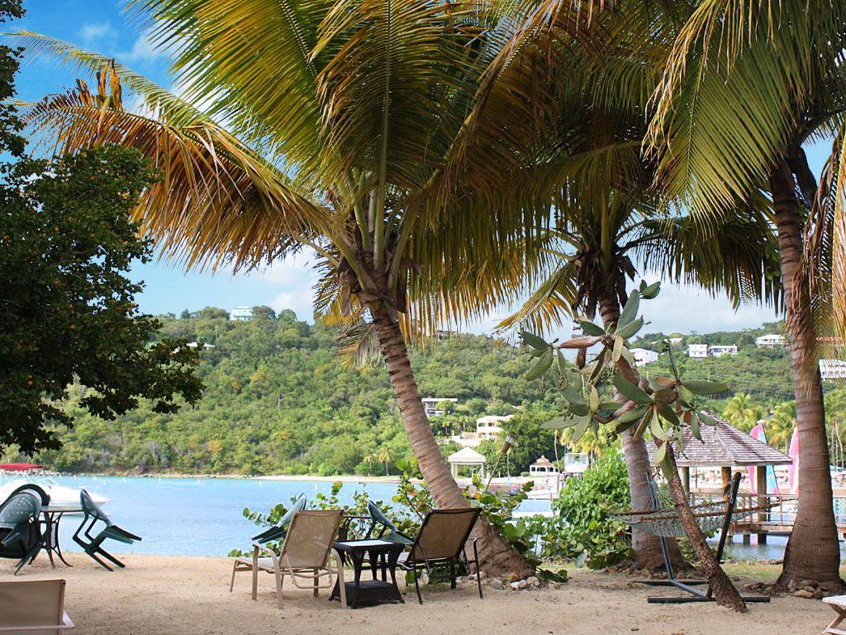 String of Pearls beachfront cottage with a hammock on the sand at Great Cruz Bay, St. John