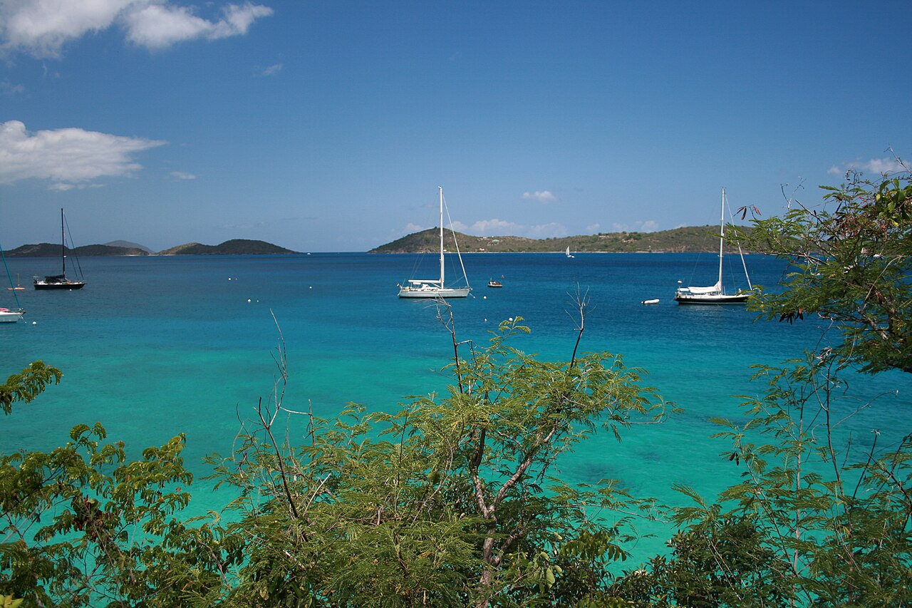 Sailboats anchored in turquoise water off Honeymoon Beach, St. John